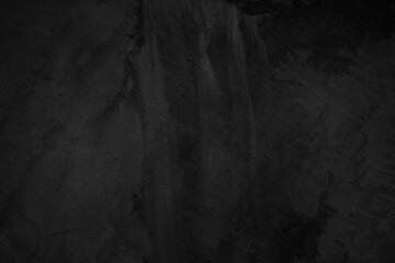 Close up retro vignette plain dark black cement (concrete) wall background texture rough old for show surface advertise or promote product and content on display and wallpaper.