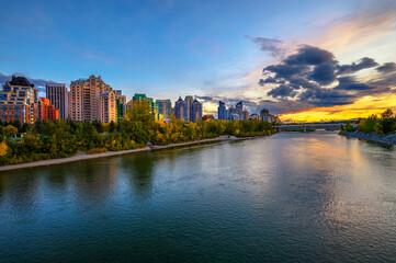 Fototapeta na wymiar Sunset above city skyline of Calgary with Bow River, Canada