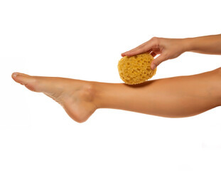 Woman pampring her foot with sponge