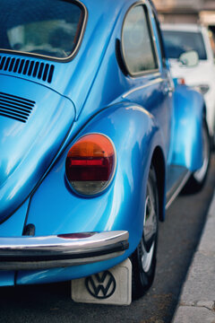 Rear view of Blue colored Volkswagen brand and VW1303 model German product car on the street.