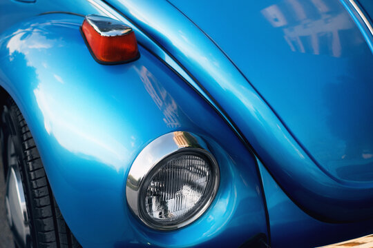 Close up shot of Front view of Blue colored Volkswagen brand and VW1303 model German product car on the street.