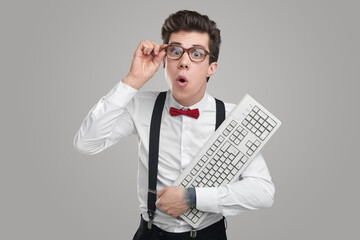 Smart nerd man with keyboard