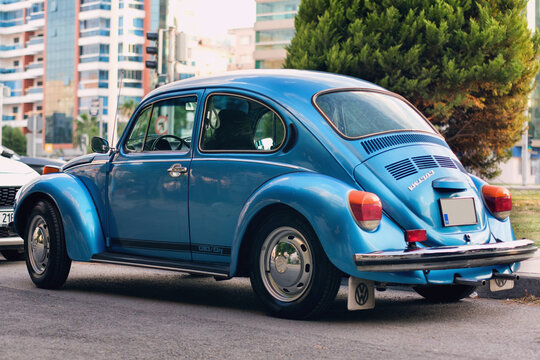 Rear view of Blue colored Volkswagen brand and VW1303 model German product car on the street.