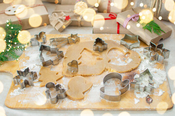 Christmas cookies cooking. Dough and molds. Christmas cookies ginger Christmas trees and Christmas decorations and tree around. Homemade food.
