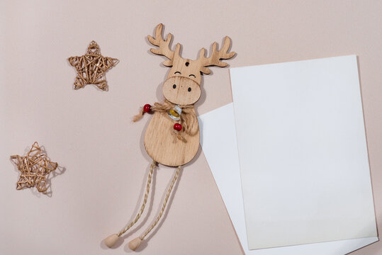 Christmas Card mockup With christmas wooden deer on beige background