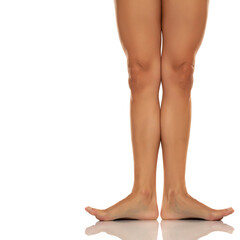 Front view of a beautiful female barefoot legs