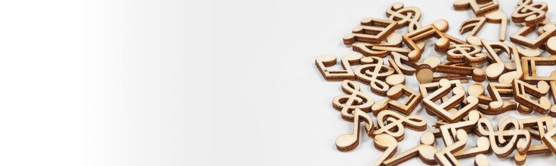 Wooden musical notes on white background