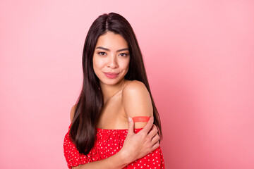 Photo of sweet millennial lady hold plaster wear red blouse isolated on pastel pink color background