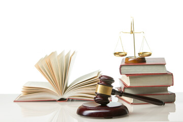 Legal Law and Justice concept - Open law book with a wooden judges gavel on table in a courtroom or law enforcement office. Copy space for text.