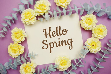 Hello Spring typography text and flower decorate on purple background