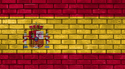 Flag of Spain Country on brick wall in grunge style. Spanish community. Graphic in industrial, urban aesthetic. Symbol of homeland.