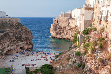 Fototapeta na wymiar city walls turning into cliffs in the bay of Grotta Piana