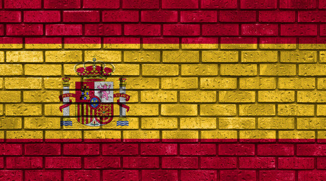 Flag of Spain Country on brick wall in grunge style. Spanish community. Graphic in industrial, urban aesthetic. Symbol of homeland. - Powered by Adobe