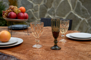Covered table on the terrace. A table wet from the rain. The atmosphere in the restaurant.