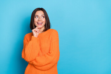 Portrait of attractive funny cheerful girl making decision copy empty blank space isolated over bright blue color background