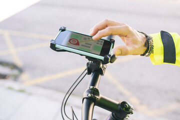 Delivery man using city map on bicycle