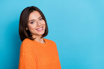 Portrait of attractive confident cheerful girl copy empty blank space isolated over bright blue...
