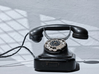 Retro telephone on gray background