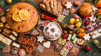 Fotobehang Christmas sweets background.Traditional Italian Christmas sweets on wooden background. © travelbook