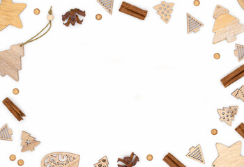 Christmas frame for holiday card, Christmas gifts and christmas tree decorations on white background, flat lay, top view