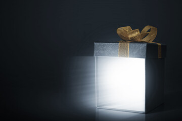 Black gift box on dark background