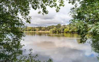 The Loire river curves gently through the countryside, framed by trees along the Loire à Vélo...