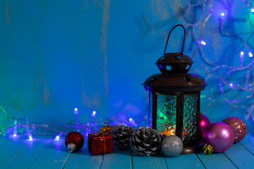 Fototapeta na wymiar CNew Year's lantern and balls on a dark background.
