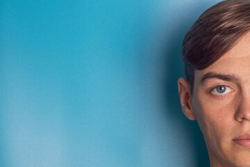 half face on blue background