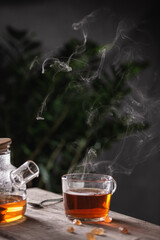 Cup of hot tea with sugar lollipops