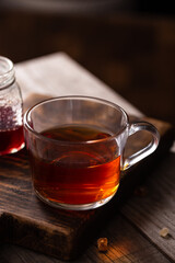Cup of hot tea with sugar lollipops