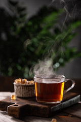 Cup of hot tea with sugar lollipops