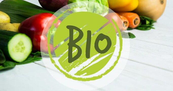 Animation of bio text in green, on green circle, over fresh vegetables on white boards