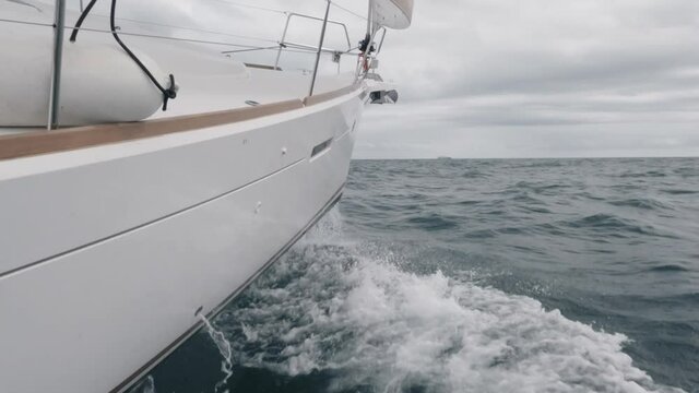 Sailing ship bow sailing into the waves in slow-mo