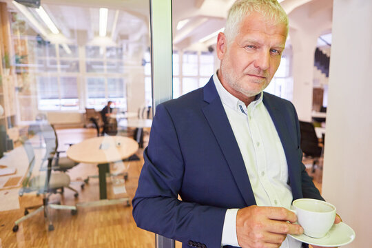 Manager with experience in a coffee break in the office