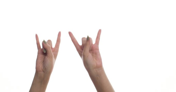 Close-up of a female hand showing rocker sign, devils horns, on a white background, to musik, on a white screen. Signs, symbols and gestures.