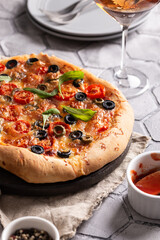 Freshly baked pizza on a wooden board