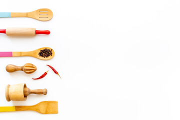 Set of wooden utensils and cookware tools, top view