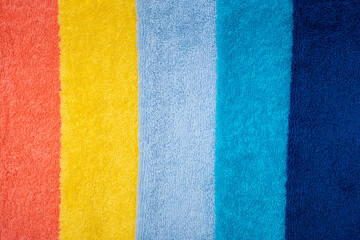 Fototapeta premium Composition of colored cotton towels. The concept of softness and purity