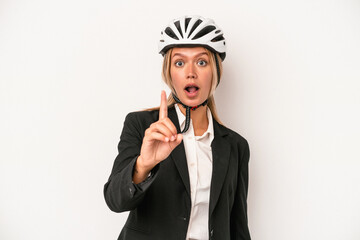 Young caucasian business woman wearing a bike helmet isolated on white background having an idea, inspiration concept.