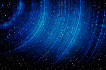 Blue abstract background with spiral pattern. Galaxies with stars and planets with circular motifs in deep blue lines of the universe night light space. No render.