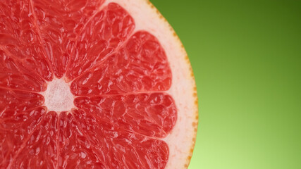 Fresh Grapefruit (orange) on green background. Grapefruit sliced, juicy, red, organic, vegetarian. 