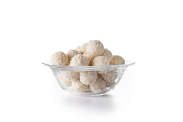 Homemade coconut balls in crystal bowl isolated on white background