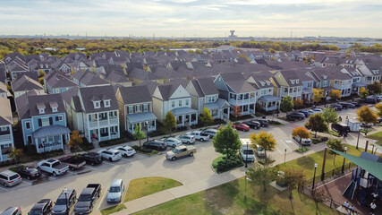 Aerial view upscale cottage houses near community park with playground suburbs Dallas, Texas