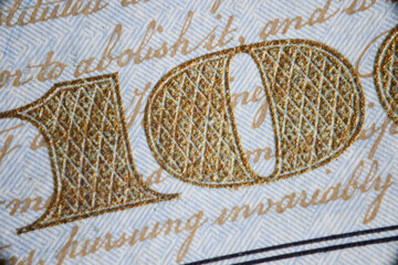 Closeup of one hundred on dollar bill background