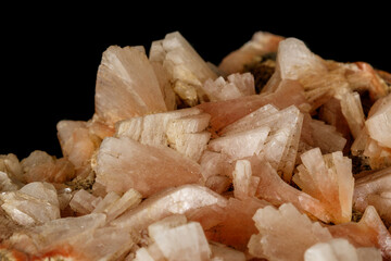 Macro of a stone Stilbite mineral on a black background