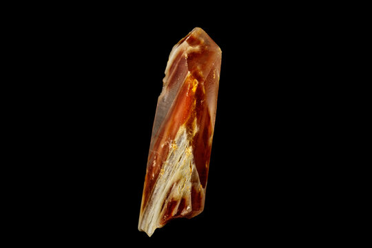 Macro of a mineral quartz stone with lepidokrokit on a black background