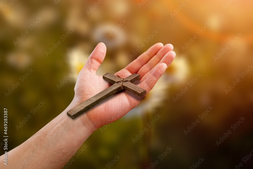 Wall mural Human hands palm up praying and worship of cross with Belief in Jesus Christ.