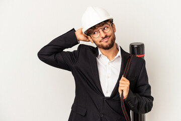 Young mixed race architect man wearing a helmet isolated on grey background touching back of head, thinking and making a choice.