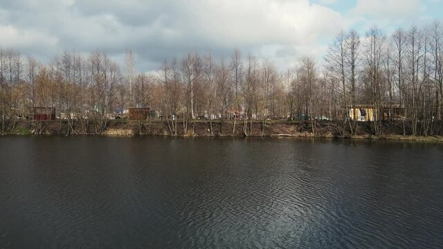 4k footage of a drone flying parallel to the shore