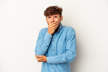 Young mixed race man isolated on grey background scared and afraid.